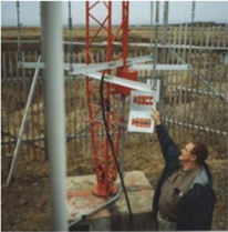 FCC inspector checking paint on transmission tower