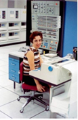 Image of woman working at an early computer with UNIX operating system